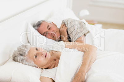 Mature woman awake in bed