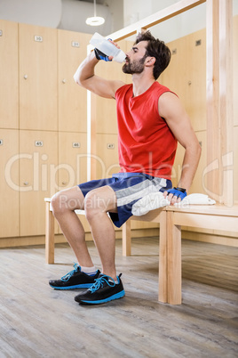 Handsome man drinking water