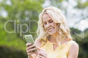 Happy woman using smartphone