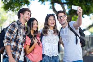 Hip friends taking selfie