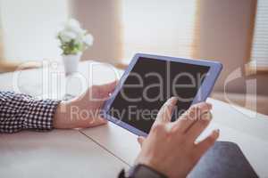 Businesswoman using her tablet
