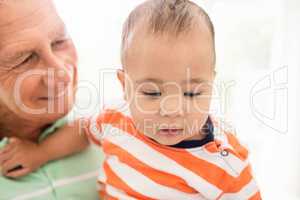 Senior man playing with his grandson