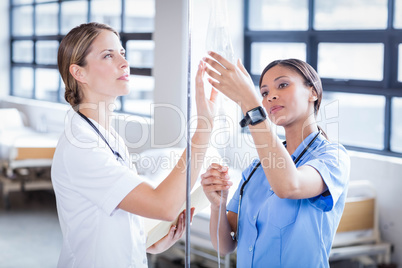 Medical team preparing an IV drip