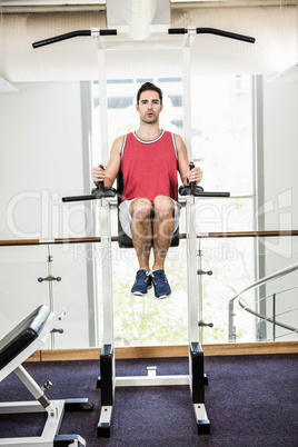 Muscular man doing pull up