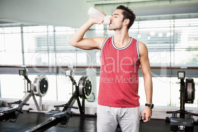 Standing man drinking water