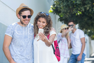 Hip couple taking selfie Hip couple taking selfie