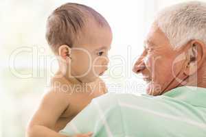 Senior man playing with his grandson