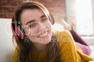 Smiling pretty woman listening music