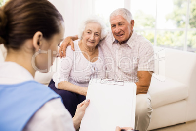 Nurse taking care of sick elderly patients