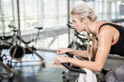 Fit woman on exercise bike