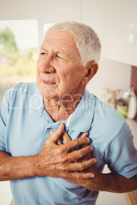 Painful senior man with pain on hea