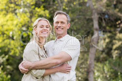 Cute couple hugging with arms around