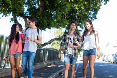 Hip friends walking and talking