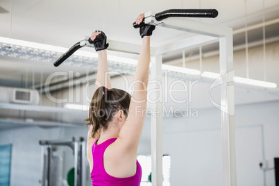 Fit woman doing pull up
