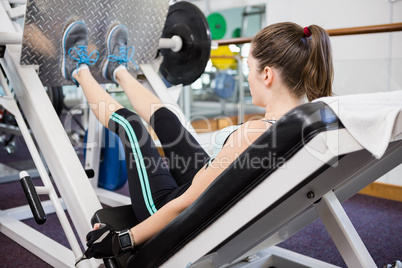 Fit brunette doing exercises for legs