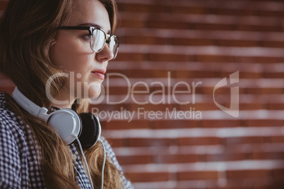 Focused hipster businesswoman with headphone