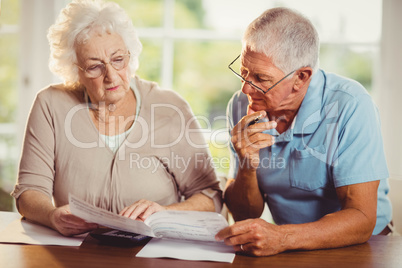 Senior couple counting bills