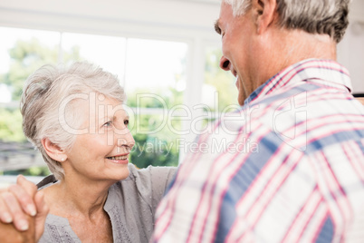 Smiling senior couple dancing