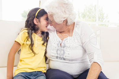 Grandmother and granddaughter looking at each other