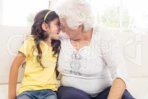 Grandmother and granddaughter looking at each other