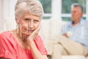 Sad senior woman after arguing with husband