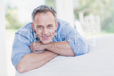 Happy man relaxing on the couch