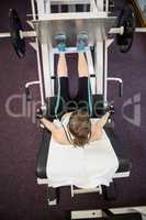 Fit brunette doing exercises for legs