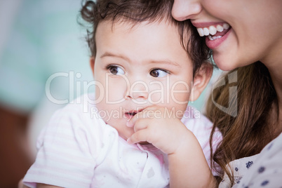 Beautiful baby held by her mother