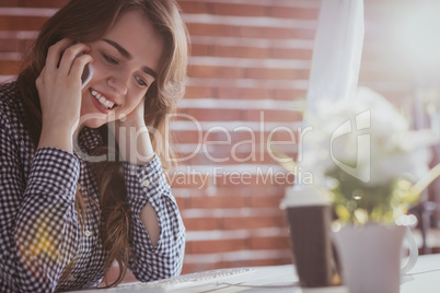 Young hipster businesswoman calling with her phone