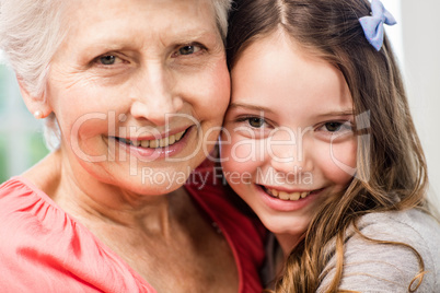 Grandmother and granddaughter embracing