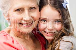 Grandmother and granddaughter embracing