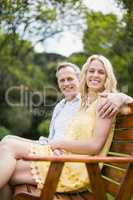 Happy couple sitting on a bench