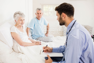 Handsome nurse visiting a mature woman