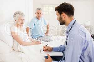 Handsome nurse visiting a mature woman
