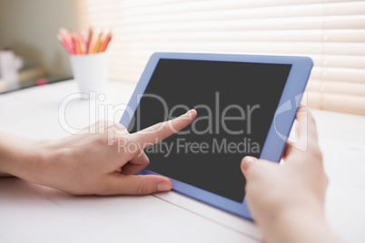 Close up view of businesswoman using her tablet