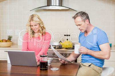 Mature couple eating breakfast