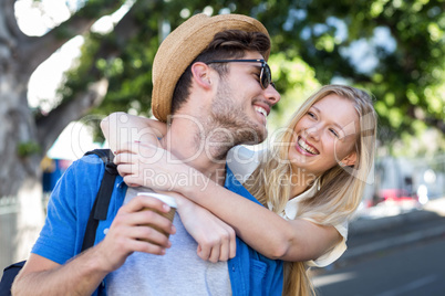 Hip couple embracing and laughing