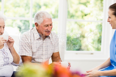 Nurse taking care of sick elderly patients