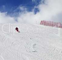 Skier on ski slope at nice sun day