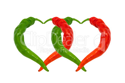Red and green chili peppers in love. Hearts composed of hot pepp