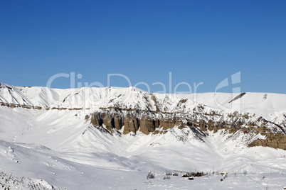 Winter mountains at sun day