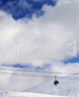 Gondola lift and off-piste slope at sun day