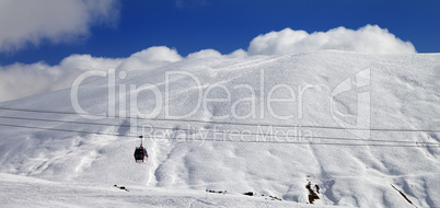 Panoramic view on gondola lift and off-piste slope