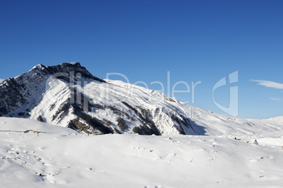 Winter mountains after snowfall at sun day