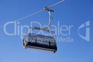Chair-lift and blue sky