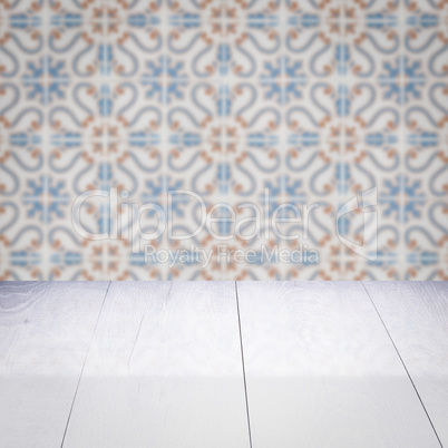 Wood table top and blur vintage ceramic tile pattern wall