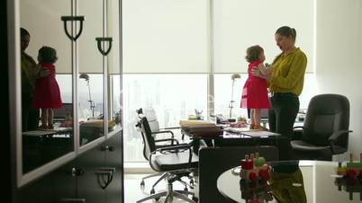 4 Business Manager Woman Playing With Daughter In Office