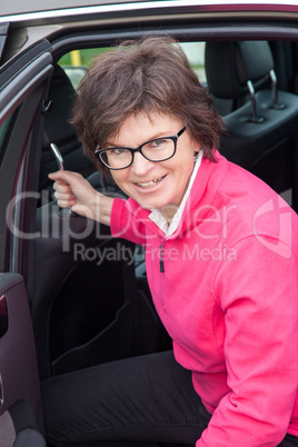 Middle-aged woman in the car