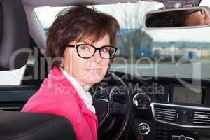 Middle-aged woman in the car