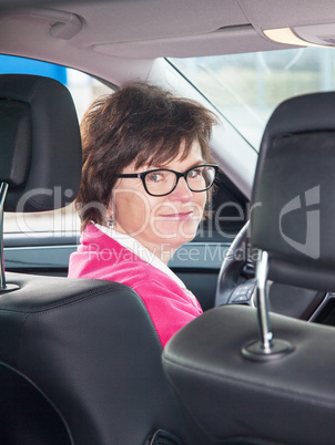 Middle-aged woman in the car